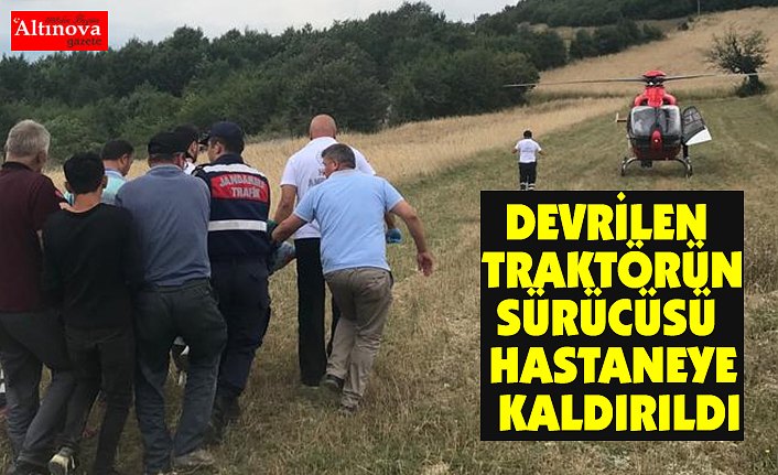 Devrilen traktörün sürücüsü ambulans helikopterle hastaneye götürüldü
