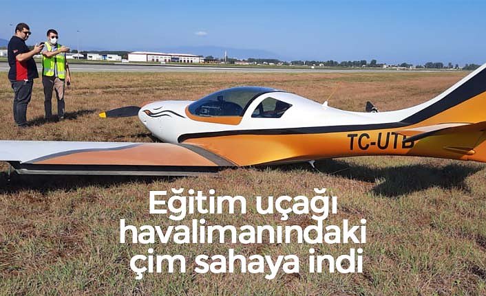 Eğitim uçağı havalimanındaki çim sahaya indi