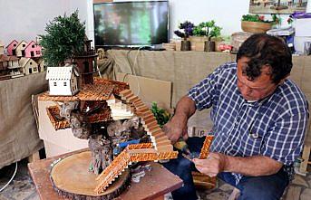 Ağaç kökleri maket evlerde hayat buluyor