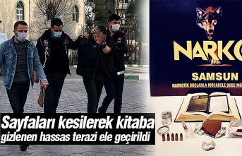 Sayfaları kesilerek kitaba gizlenen hassas terazi ele geçirildi