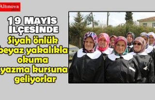 Siyah önlük beyaz yakalıkla okuma yazma kursuna...