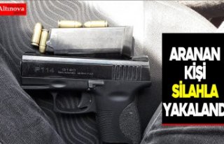 Aranan kişi silahla yakalandı
